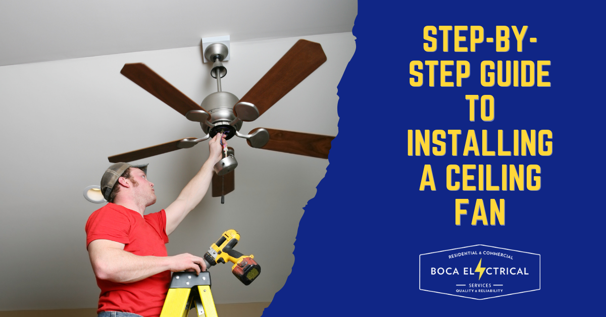 man holding a tool while installing a ceiling fan